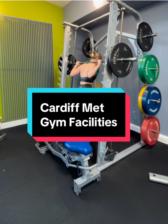 A young woman prepares to squad with a barbell, with the digital caption 